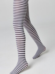 tights in black and white stripes on the legs girls isolated 