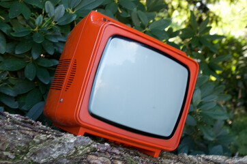 a stylish orange TV from the 70s - 652868286