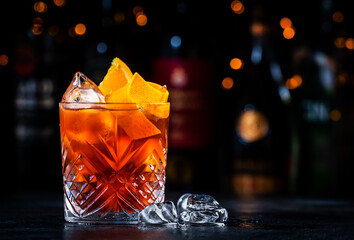 Espresso Negroni cocktail drink with dry gin, red vermouth and bitter, espresso, coffee liqueur,...