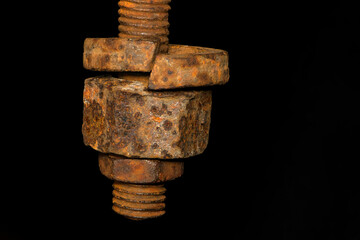 rusty nut. Rusty iron rod with screw threads. Rusted mechanical components. threaded bolt and nut isolated close up. dismantling concept, difficult to unscrew, non-removable. selective focus