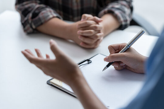 Asian female doctor using a stethoscope to examine a patient, ask for information, give advice, comfort, plan a course of treatment and preventive care. concept of health check