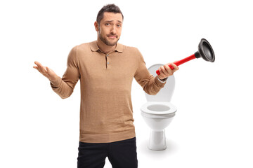 Confused guy holding a plunger in front of a toilet