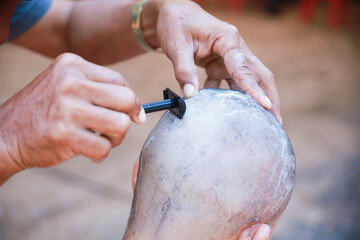 The culture of shaving men's hair is preparation before the Buddhist monk ordination ceremony. - obrazy, fototapety, plakaty