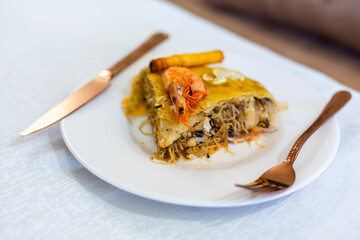 Traditional Moroccan pastilla with different seafood