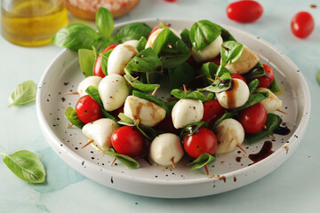 A plate with Italian salad caprese canape