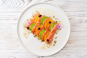 Salmon ceviche with avocado, orange and mango salsa