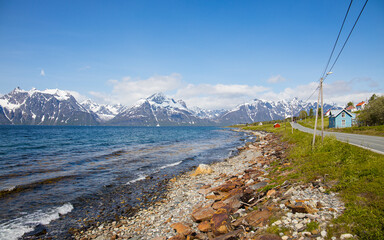 Shoreline of Lyngenfjord in Norway above arctic circle an a beautiful windy summer day