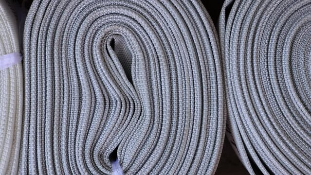 flexible lay flat hose for outdoor lawn or garden watering,polyester  expandable for car washing cleaning pool. outside market shop store, red and white colors 4k