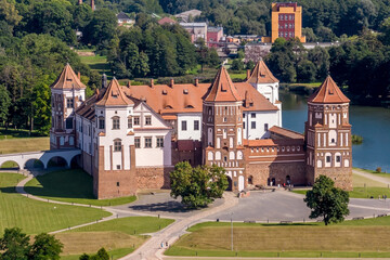 Fototapeta na wymiar aerial view on overlooking restoration of the historic castle or palace near lake