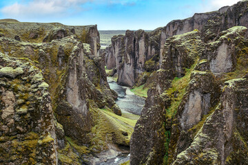 Whispers of ancient tales: Fjaðrárgljúfur's timeless beauty carved by the hands of nature.