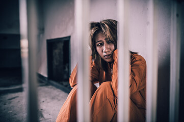 Portrait of women desperate to catch the iron prison,prisoner concept,thailand people,Hope to be...
