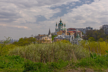 Kyiv, Ukraine – April 23, 2023: Top  view on historical St Andrew's Church. A beautiful panorama...