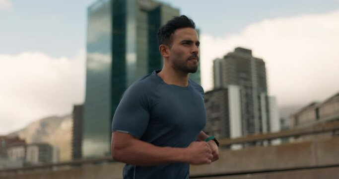 Running, fitness and man in city on street for marathon training, exercise and cardio workout. Sports, runner and person in road for performance, endurance and wellness for competition and race