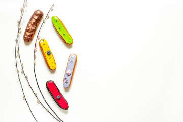 Pattern of various glased eclairs cakes. Sweet food background