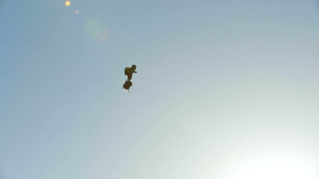 Technology of human flight. Man flying with jet pack strapped to feet. 