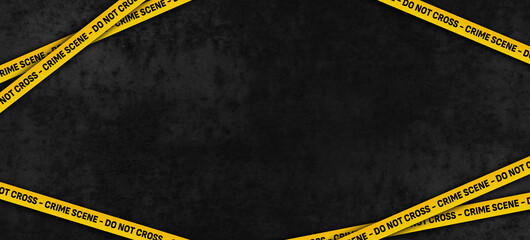 Yellow police tape - Crime scene Do not cross against dark abstract background.