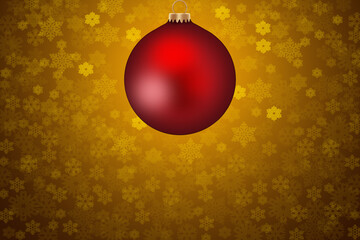 Uma bola vermelha de Natal com fundo dourado com brilhos.