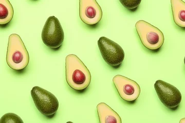 Zelfklevend Fotobehang Avocado pattern on green background for ads © ditosw