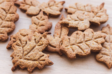 Autumn leaf shaped cookie of gingerbread dough. Autumn festive cookies. Handmade bakery....