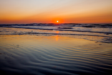 los colores del amanecer en la playa