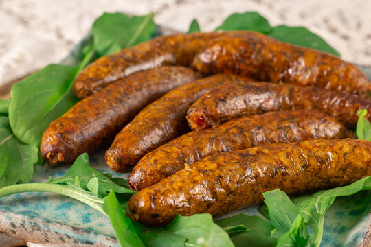Mumbar is a type of sausage of middle eastern origin that is made with mutton, rice, black pepper, salt and cinnamon stuffed into an intestine casing - after the sausage has been cooked by boiling. 