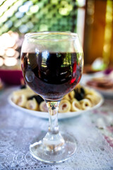 glass of wine in a glass, red wine, festive table 
