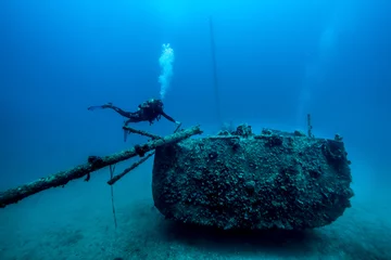 Foto op Canvas Diving in Montenegro. In beautiful Kotor Bay there is old Yugoslavian patrol boat that is at the bottom of the Bay at around 25 meters. © Sergej Kozacenko