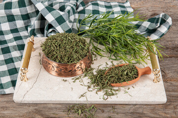 Tarragon or estragon.Fresh and dry tarragon herb. Raw and dry tarragon spice.Tarragon or Artemisia...