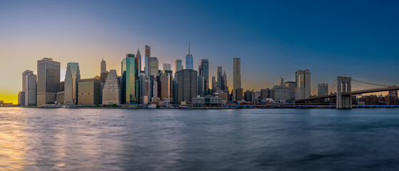 Panoramic cityscape about lower Manhattan's skyscrapers.  The photo taken from brooklyn bridge...