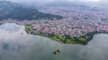 Aerial view of Pokhara, Nepal. Phewa lake in the foreground and mountains with cityscape in the background