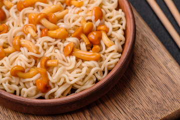 Delicious Asian cuisine dish with rice noodles, peppers, mushrooms and spices