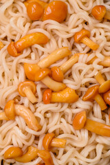 Delicious Asian cuisine dish with rice noodles, peppers, mushrooms and spices