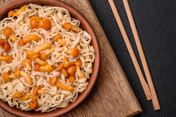 Delicious Asian cuisine dish with rice noodles, peppers, mushrooms and spices