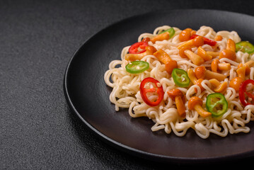 Delicious Asian cuisine dish with rice noodles, peppers, mushrooms and spices