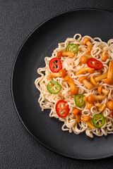 Delicious Asian cuisine dish with rice noodles, peppers, mushrooms and spices