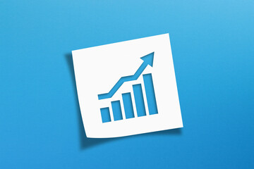 Business development and growth concept with note paper on blue background
