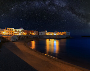 Starry night above Gallipoli, province of Lecce, Puglia, southern Italy.  View from walls of...