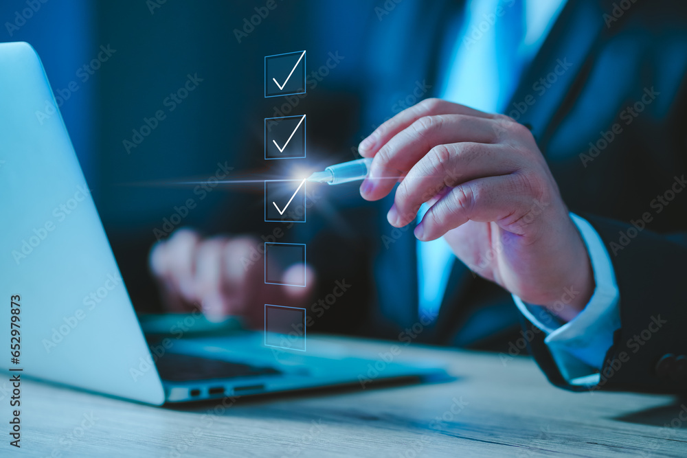 Poster person ticking checkboxes with marker pen on checklist. Businessman use pen to tick correct sign mark in checkbox for quality document control checklist and business approve project concept.