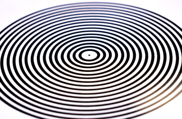 Abstract pop art circles, circular black and white monochrome hypnotic pattern closeup, soft focus,...