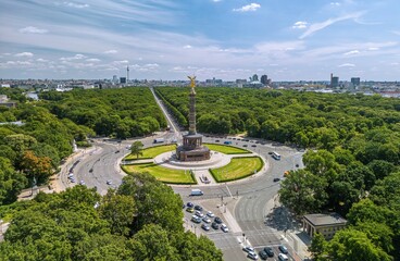 Obraz na płótnie Canvas The drone aerial view of The Victory column in Berlin Tiergarten, at sunny summer day Berlin, Germany. Siegessaule was designed to commemorate the Prussion victory in the Prussian-Danish War.