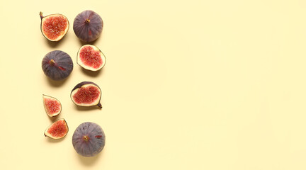 Fresh ripe figs on yellow background with space for text, top view