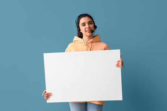 Female technical support agent with blank poster on blue background - Powered by Adobe