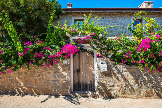 Old Datca Region in Mugla, Turkey. Nostalgic stone houses typical of the Old Datca Region. Datca, Mugla. Beautiful street view with begonville.