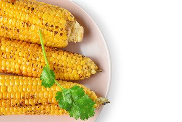 Plate with tasty grilled corn cobs and parsley on white background