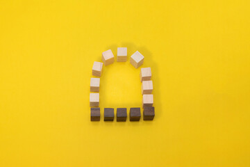 Fototapeta na wymiar 黄色い背景のウッドキューブの窓をモチーフにしたフレーム素材
