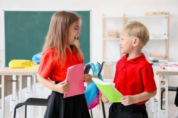 Little children in classroom at school