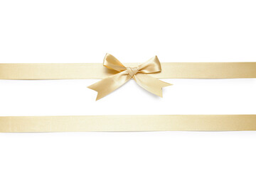 Bow made from golden satin ribbon on white background