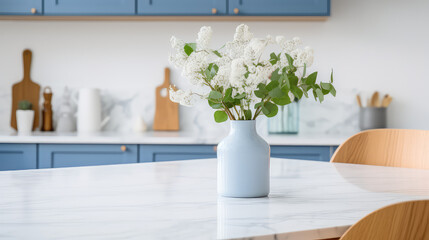 Vase with fresh spring flowers on dinning table on the background of modern kitchen in Scandinavian interior style. Light white blue colors.  - obrazy, fototapety, plakaty