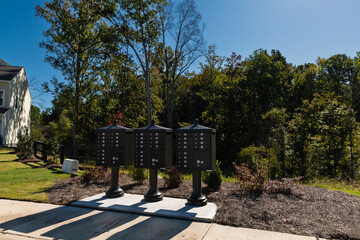 Post office cluster mailboxes with pedestal design for new homes. Post office mail and real estate concept.