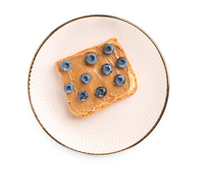 Plate of toast with peanut butter and blueberries on white background